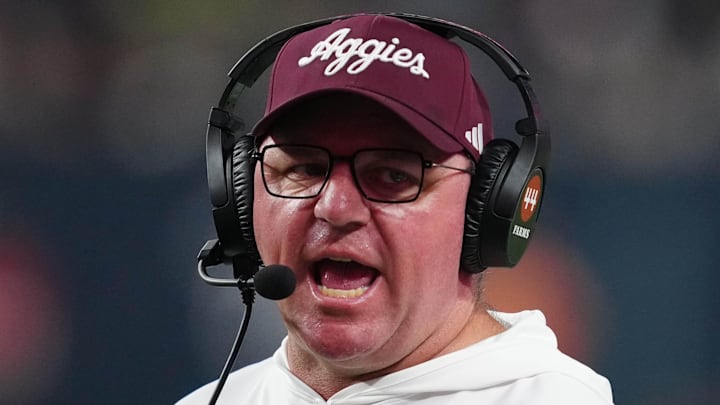 Dec 27, 2024; Las Vegas, NV, USA; Texas A&M Aggies head coach Mike Elko reacts against the Southern California Trojans in the second half at Allegiant Stadium. Mandatory Credit: Kirby Lee-Imagn Images