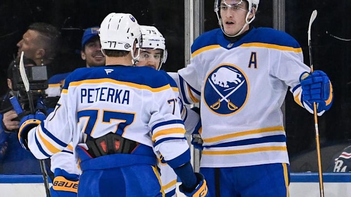 Nov 7, 2024; New York, New York, USA;  Buffalo Sabres right wing JJ Peterka (77) celebrates a goal by Buffalo Sabres center Tage Thompson (72) against the New York Rangers during the second period at Madison Square Garden. Mandatory Credit: Dennis Schneidler-Imagn Images