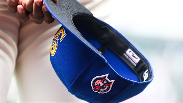 Sep 11, 2022; Seattle, Washington, USA; A member of the Seattle Mariners holds a baseball hat with a patch honoring the victims of the September 11th terrorist attacks before the game against the Atlanta Braves at T-Mobile Park. Mandatory Credit: Lindsey Wasson-Imagn Images Sep 11, 2022; Seattle, Washington, USA; A member of the Seattle Mariners holds a baseball hat with a patch honoring the victims of the September 11th terrorist attacks before the game against the Atlanta Braves at T-Mobile Park. Mandatory Credit: Lindsey Wasson-Imagn Images