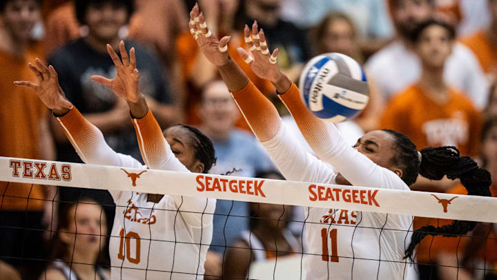 Texas Longhorns opposite hitter Reagan Rutherford (10) and middle blocker Marianna Singletary (11) jump for a block in the Longhorns' game against the South Carolina Gamecocks in the Gregory Gymnasium in Austin, Oct. 2, 2024.