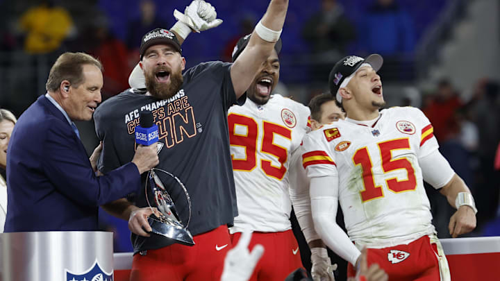 Jan 28, 2024; Baltimore, Maryland, USA; Kansas City Chiefs tight end Travis Kelce (M) celebrates with the Lamar Hunt trophy next to Chiefs defensive tackle Chris Jones (95) and Chiefs quarterback Patrick Mahomes (15) while speaking with CBS broadcaster Jim Nantz (L) after the Chiefs' game against the Baltimore Ravens in the AFC Championship football game at M&T Bank Stadium. Mandatory Credit: Geoff Burke-Imagn Images