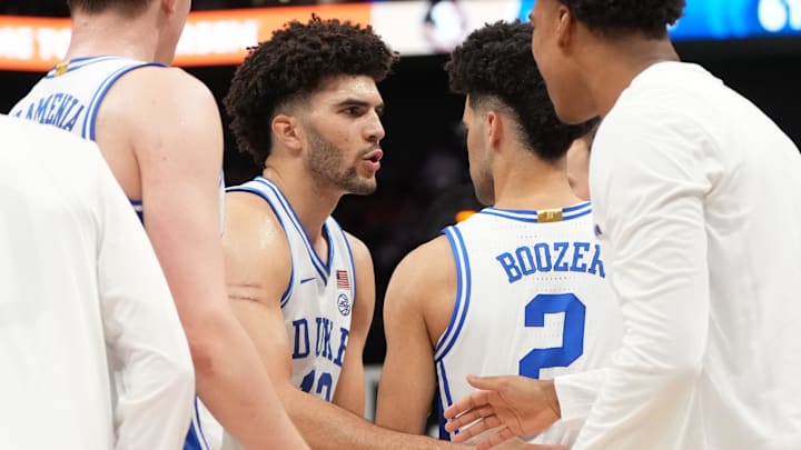 Mar 12, 2026; Charlotte, NC, USA; Duke Blue Devils forward Cameron Boozer (12) with guard Cayden Boozer (2) in the second half at Spectrum Center. 