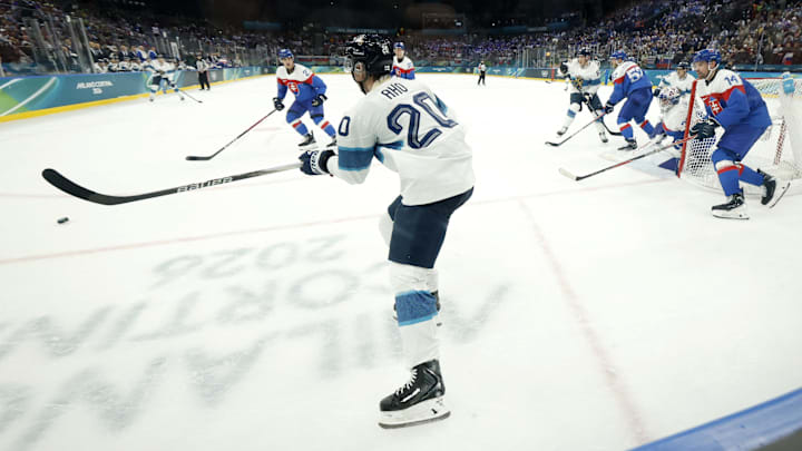 Feb 11, 2026; Milan, Italy; Sebastian Aho of Finland in action with Peter Ceresnak of Slovakia and Adam Ruzicka of Slovakia in men's ice hockey group B play during the Milano Cortina 2026 Olympic Winter Games at Milano Santagiulia Ice Hockey Arena. Mandatory Credit: Geoff Burke-Imagn Images