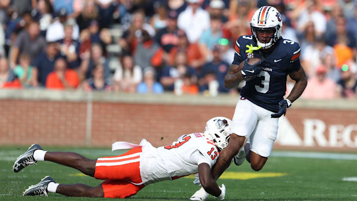 Nov 22, 2025; Auburn, Alabama, USA; Auburn Tigers wide receiver Perry Thompson (3) is tackled by Mercer Bears safety Juwan Johnson (13) during the second quarter at Jordan-Hare Stadium. Mandatory Credit: John Reed-Imagn Images Nov 22, 2025; Auburn, Alabama, USA; Auburn Tigers wide receiver Perry Thompson (3) is tackled by Mercer Bears safety Juwan Johnson (13) during the second quarter at Jordan-Hare Stadium. Mandatory Credit: John Reed-Imagn Images