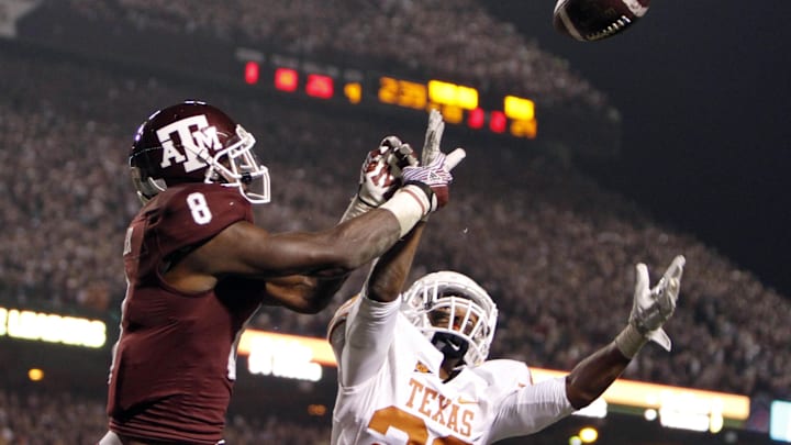 Nov 24, 2011; College Station, TX, USA; Texas Longhorns cornerback Carrington Byndom (23) breaks up a pass intended for Texas A&M Aggies wide receiver Jeff Fuller (8) in the fourth quarter at Kyle Field. Texas defeated Texas A&M 27-25.  Mandatory Credit: Brett Davis-Imagn Images