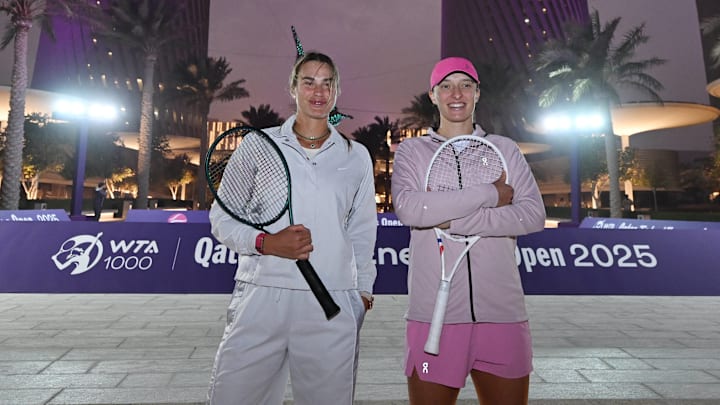 Aryna Sabalenka (BLR) and Iga Swiatek (POL) at an event for the Qatar TotalEnergies Open 2025.