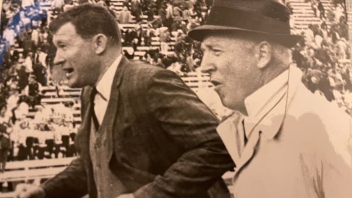 JIm Owens and John McKay meet in a wet and cold Husky Stadium.