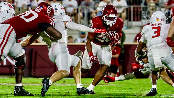 Oklahoma running back Jonathan Hatton Jr. rushes against New Mexico. Oklahoma running back Jonathan Hatton Jr. rushes against New Mexico.