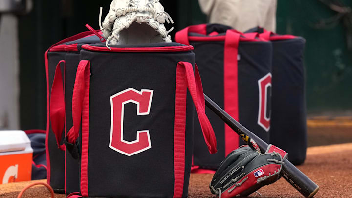 Mar 30, 2024; Oakland, California, USA; Cleveland Guardians equipment sits in front of the dugout before the game against the Oakland Athletics at Oakland-Alameda County Coliseum. Mandatory Credit: Darren Yamashita-Imagn Images
