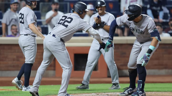Jun 25, 2024; New York City, New York, USA; New York Yankees center fielder Aaron Judge (99) celebrates his grand slam home run against the New York Mets with right fielder Juan Soto (22) and catcher Austin Wells (28) and outfielder Trent Grisham (12) during the eighth inning at Citi Field. Mandatory Credit: Brad Penner-USA TODAY Sports Jun 25, 2024; New York City, New York, USA; New York Yankees center fielder Aaron Judge (99) celebrates his grand slam home run against the New York Mets with right fielder Juan Soto (22) and catcher Austin Wells (28) and outfielder Trent Grisham (12) during the eighth inning at Citi Field. Mandatory Credit: Brad Penner-USA TODAY Sports