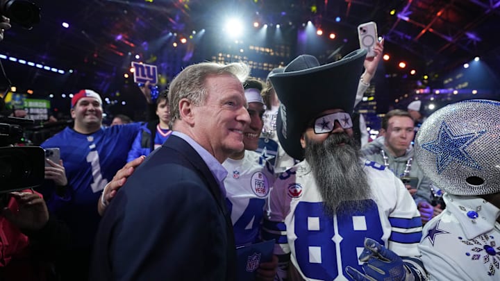NFL commissioner Roger Goodell poses with fans during the 2024 NFL Draft at Campus Martius Park and Hart Plaza. 