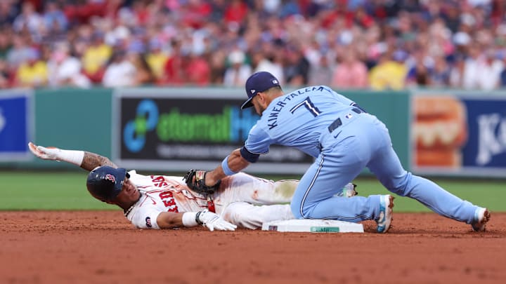 Jun 24, 2024; Boston, Massachusetts, USA; Boston Red Sox shortstop Ceddanne Rafaela (43) is tagged out by Toronto Blue Jays shortstop Isiah Kiner-Falefa (7) during the third inning at Fenway Park. Mandatory Credit: Paul Rutherford-Imagn Images