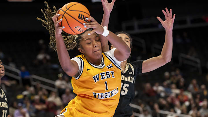 Mar 7, 2026; Kansas City, MO, USA; West Virginia Mountaineers forward Carter McCray (1) brings down a rebound against the Colorado Buffaloes during the second half at T-Mobile Center. Mandatory Credit: Nick Tre. Smith-Imagn Images Mar 7, 2026; Kansas City, MO, USA; West Virginia Mountaineers forward Carter McCray (1) brings down a rebound against the Colorado Buffaloes during the second half at T-Mobile Center. Mandatory Credit: Nick Tre. Smith-Imagn Images