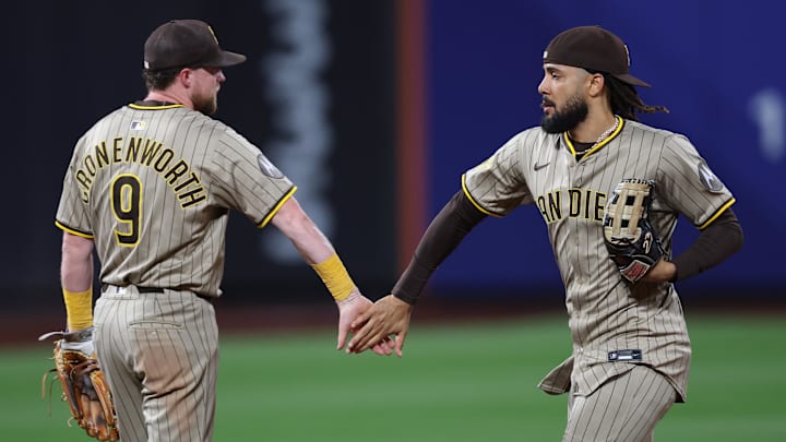 Sep 17, 2025; New York City, New York, USA; San Diego Padres second baseman Jake Cronenworth (9) celebrates with right fielder Fernando Tatis Jr. (23) after the game against the New York Mets at Citi Field. Mandatory Credit: Vincent Carchietta-Imagn Images