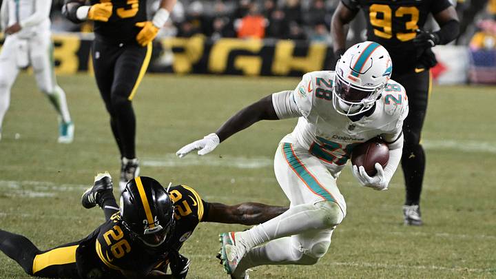 Dolphins running back De'Von Achane escapes a tackle by Steelers cornerback Brandin Echols. Dolphins running back De'Von Achane escapes a tackle by Steelers cornerback Brandin Echols.