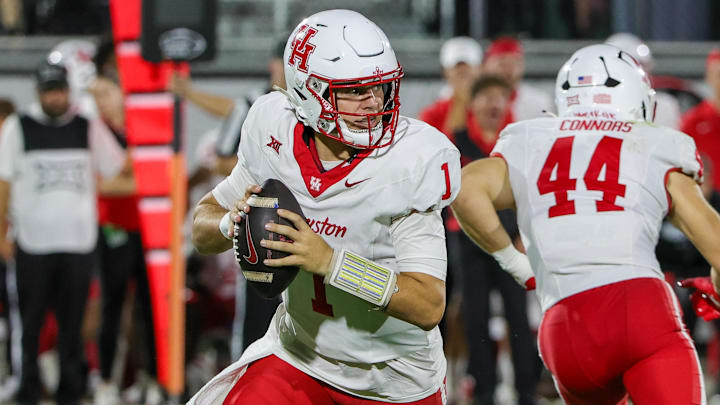 Houston Cougars quarterback Conner Weigman (1) looks to pass during the first quarter against the UCF Knights at Acrisure Bounce House. 