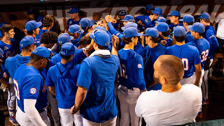 Jun 19, 2024; Omaha, NE, USA; The Florida Gators meet in the dugout after being defeated by the Texas A&M Aggies at Charles Schwab Field Omaha. Mandatory Credit: Dylan Widger-Imagn Images Jun 19, 2024; Omaha, NE, USA; The Florida Gators meet in the dugout after being defeated by the Texas A&M Aggies at Charles Schwab Field Omaha. Mandatory Credit: Dylan Widger-Imagn Images