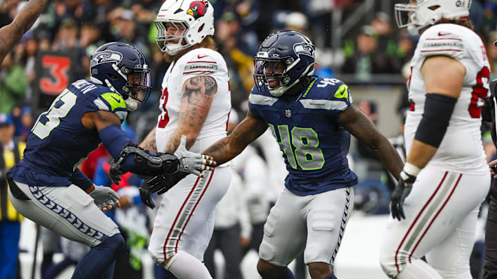 Nov 24, 2024; Seattle, Washington, USA; Seattle Seahawks linebacker Tyrice Knight (48) celebrates with linebacker Ernest Jones IV (13) following a sack against the Arizona Cardinals during the first quarter at Lumen Field. Mandatory Credit: Joe Nicholson-Imagn Images Nov 24, 2024; Seattle, Washington, USA; Seattle Seahawks linebacker Tyrice Knight (48) celebrates with linebacker Ernest Jones IV (13) following a sack against the Arizona Cardinals during the first quarter at Lumen Field. Mandatory Credit: Joe Nicholson-Imagn Images