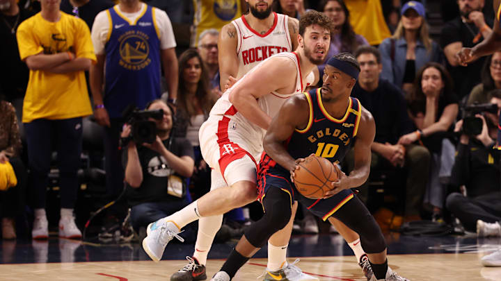 Apr 28, 2025; San Francisco, California, USA; Golden State Warriors forward Jimmy Butler III (10) controls the ball below Houston Rockets center Alperen Sengun (28) during the fourth quarter of game four of the 2025 NBA Playoffs first round at Chase Center. Mandatory Credit: Kelley L Cox-Imagn Images