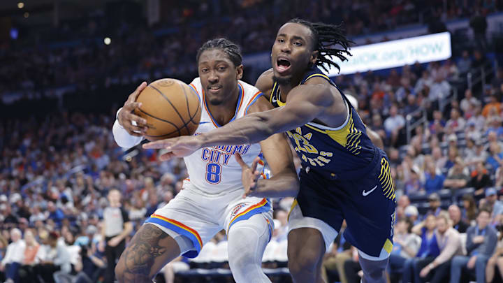 Mar 29, 2025; Oklahoma City, Oklahoma, USA; Indiana Pacers forward Aaron Nesmith (23) and Oklahoma City Thunder forward Jalen Williams (8) fight for control of the ball during the second half at Paycom Center. Mandatory Credit: Alonzo Adams-Imagn Images