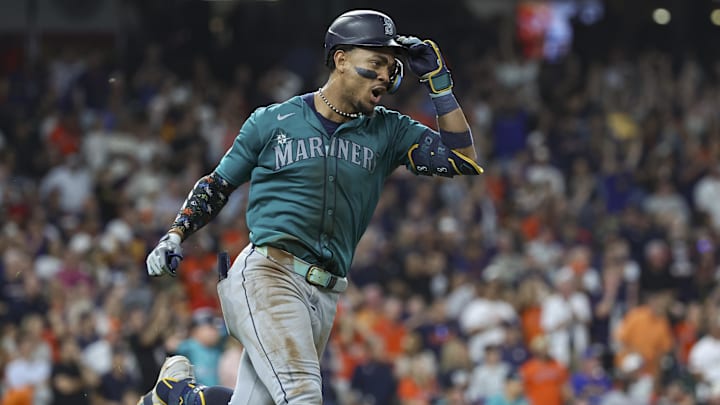 Seattle Mariners center fielder Julio Rodriguez celebrates after hitting an RBI single against the Houston Astros on Tuesday at Minute Maid Park.