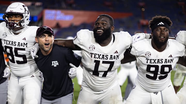 Sep 14, 2024; Gainesville, Florida, USA; Texas A&M Aggies tight end Jaden Platt (85), defensive lineman Albert Regis (17), and defensive lineman Gabriel Brownlow-Dindy (99) celebrate after defeating the Florida Gators at Ben Hill Griffin Stadium. Mandatory Credit: Matt Pendleton-Imagn Images