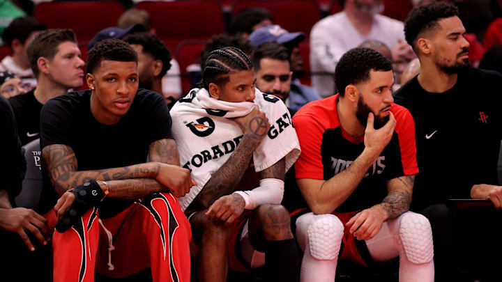 Jan 3, 2025; Houston, Texas, USA; (from L-to-R) Houston Rockets forward Jabari Smith Jr (10), guard Jalen Green (4) and guard Fred VanVleet (5) sit on the bench against the Boston Celtics during the game at Toyota Center. Mandatory Credit: Erik Williams-Imagn Images