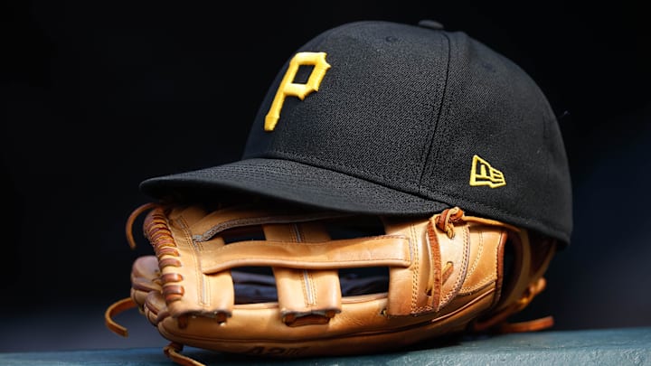 Jun 30, 2021; Denver, Colorado, USA; A general view of a Pittsburgh Pirates glove and hat in the eighth inning against the Colorado Rockies at Coors Field. Mandatory Credit: Isaiah J. Downing-Imagn Images Jun 30, 2021; Denver, Colorado, USA; A general view of a Pittsburgh Pirates glove and hat in the eighth inning against the Colorado Rockies at Coors Field. Mandatory Credit: Isaiah J. Downing-Imagn Images