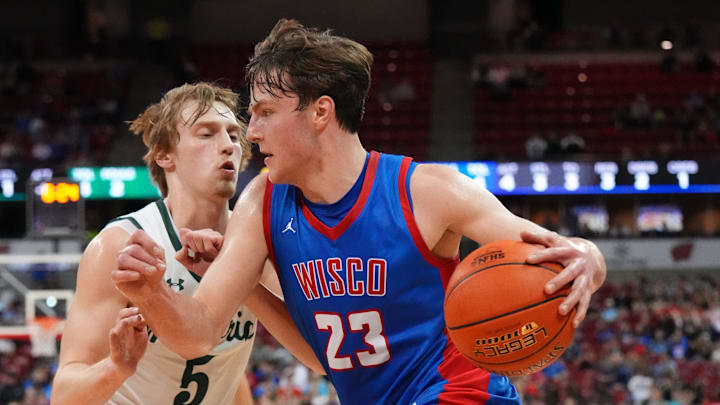 Wisconsin Lutheran's Zavier Zens (23) breaks around Madison Memorial's Cole Slack (5) during the WIAA Division 1 boys state championship basketball game on Saturday, March 21, 2026, at the Kohl Center in Madison, Wisconsin. Wisconsin Lutheran's Zavier Zens (23) breaks around Madison Memorial's Cole Slack (5) during the WIAA Division 1 boys state championship basketball game on Saturday, March 21, 2026, at the Kohl Center in Madison, Wisconsin.
