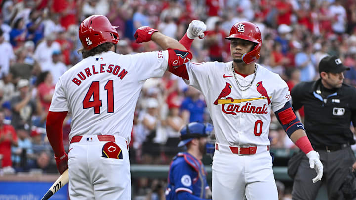 Jul 30, 2024; St. Louis, Missouri, USA;  St. Louis Cardinals shortstop Masyn Winn (0) is congratulated by left fielder Alec Burleson (41) after hitting a solo home run against the Texas Rangers during the first inning at Busch Stadium. Mandatory Credit: Jeff Curry-Imagn Images
