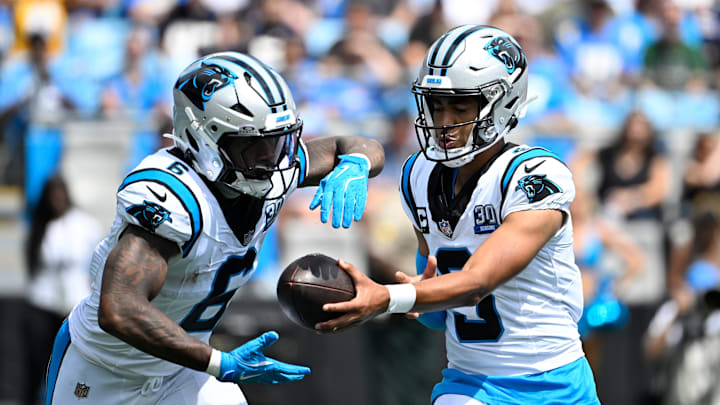 Sep 15, 2024; Charlotte, North Carolina, USA; Carolina Panthers quarterback Bryce Young (9) hand the ball off to running back Miles Sanders (6) in the first quarter at Bank of America Stadium. Mandatory Credit: Bob Donnan-Imagn Images Sep 15, 2024; Charlotte, North Carolina, USA; Carolina Panthers quarterback Bryce Young (9) hand the ball off to running back Miles Sanders (6) in the first quarter at Bank of America Stadium. Mandatory Credit: Bob Donnan-Imagn Images