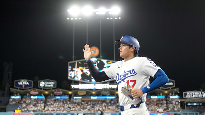 Los Angeles Dodgers designated hitter Shohei Ohtani (17) returns to the dugout after scoring in the seventh inning against the Colorado Rockies at Dodger Stadium on Sept. 8.