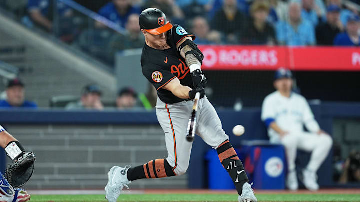 Mar 27, 2025; Toronto, Ontario, CAN; Baltimore Orioles right ielder Tyler O'Neill (9) hits a single against the Toronto Blue Jays during the fifth inning at Rogers Centre. Mar 27, 2025; Toronto, Ontario, CAN; Baltimore Orioles right ielder Tyler O'Neill (9) hits a single against the Toronto Blue Jays during the fifth inning at Rogers Centre.
