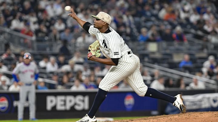 May 16, 2025; Bronx, New York, USA; New York Yankees pitcher Yerry De los Santos (73) pitches against the New York Mets during the ninth inning at Yankee Stadium. Mandatory Credit: John Jones-Imagn Images