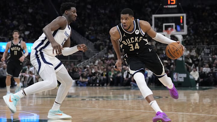 Feb 2, 2025; Milwaukee, Wisconsin, USA; Milwaukee Bucks forward Giannis Antetokounmpo (34) drives to the basket against Memphis Grizzlies forward Jaren Jackson Jr. (13) in the first half at Fiserv Forum. Mandatory Credit: Michael McLoone-Imagn Images