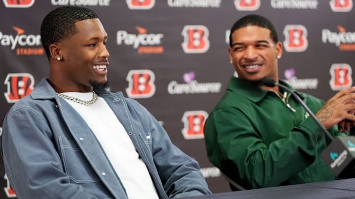 Ja’marr Chase reacts to Tee Higgins saying he plans to send his new money on an aquarium built into the wall of his home during a press conference to announce the signing of new contracts for Cincinnati Bengals wide receivers Ja’Marr Chase and Tee Higgins at Paycor Stadium in downtown Cincinnati on Tuesday, March 18, 2025. Chase becomes the new highest-paid non-quarterback player in the NFL.