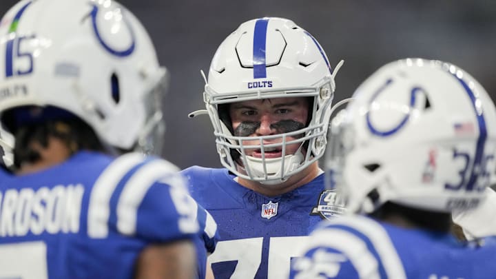 Sep 10, 2023; Indianapolis, Indiana, USA; Indianapolis Colts guard Will Fries (75) talks with teammates Sunday, Sept. 10, 2023, during a game against the Jacksonville Jaguars at Lucas Oil Stadium. 