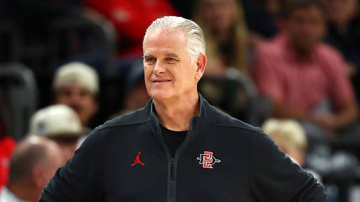 Dec 20, 2025; Phoenix, Arizona, USA; San Diego State Aztecs head coach Brian Dutcher. Dec 20, 2025; Phoenix, Arizona, USA; San Diego State Aztecs head coach Brian Dutcher.
