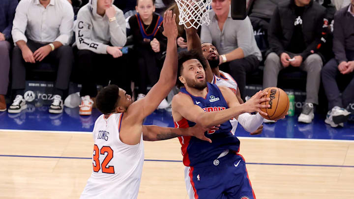 Jan 13, 2025; New York, New York, USA; Detroit Pistons guard Cade Cunningham (2) drives to the basket against New York Knicks center Karl-Anthony Towns (32) and forward Mikal Bridges (25) during the fourth quarter at Madison Square Garden. Mandatory Credit: Brad Penner-Imagn Images