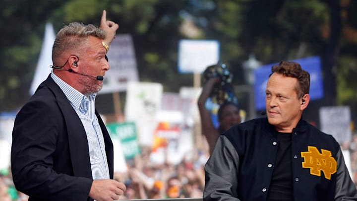 ESPN's Pat McAfee, left, points toward \"Touchdown Jesus\" while picking Notre Dame to beat Ohio State during \"College GameDay\" Saturday at Notre Dame.