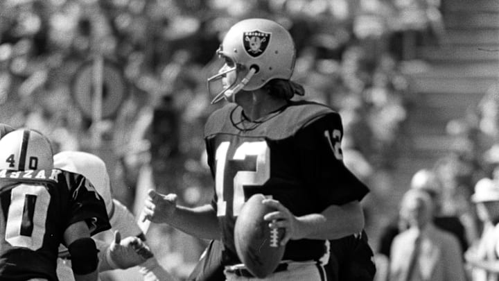 Dec 8, 1973; Oakland, CA, USA: FILE PHOTO; Oakland Raiders quarterback Ken Stabler (12) looks downfield for a receiver against the Kansas City Chiefs at the Oakland Coliseum. Mandatory Credit: Rod Hanna-Imagn Images