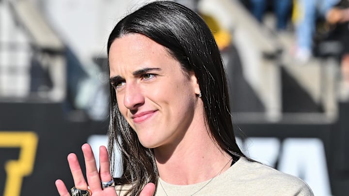 Oct 26, 2024; Iowa City, Iowa, USA; Former Iowa Hawkeye and current Indiana Fever WNBA star Caitlin Clark looks on while being honored during the game between the Iowa Hawkeyes and the Northwestern Wildcats at Kinnick Stadium. Mandatory Credit: Jeffrey Becker-Imagn Images Oct 26, 2024; Iowa City, Iowa, USA; Former Iowa Hawkeye and current Indiana Fever WNBA star Caitlin Clark looks on while being honored during the game between the Iowa Hawkeyes and the Northwestern Wildcats at Kinnick Stadium. Mandatory Credit: Jeffrey Becker-Imagn Images