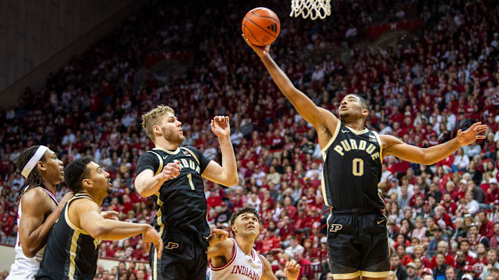 Purdue's C.J. Cox (0) grabs a rebound during the Indiana versus Purdue 