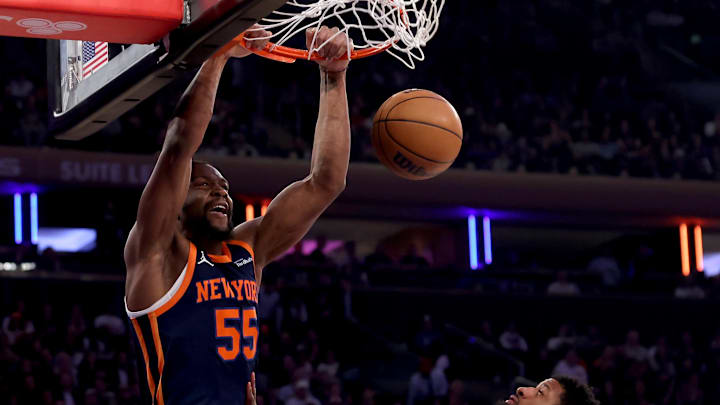 Feb 26, 2025; New York, New York, USA; New York Knicks center Ariel Hukporti (55) dunks against Philadelphia 76ers center Andre Drummond (1) and forward Paul George (8) during the first quarter at Madison Square Garden. Mandatory Credit: Brad Penner-Imagn Images Feb 26, 2025; New York, New York, USA; New York Knicks center Ariel Hukporti (55) dunks against Philadelphia 76ers center Andre Drummond (1) and forward Paul George (8) during the first quarter at Madison Square Garden. Mandatory Credit: Brad Penner-Imagn Images