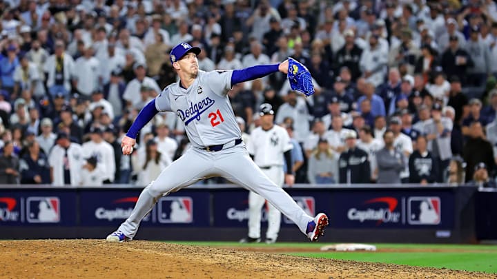 Oct 30, 2024; New York, New York, USA; Los Angeles Dodgers pitcher Walker Buehler (21) pitches during the ninth inning against the New York Yankees in Game 5 of the 2024 MLB World Series at Yankee Stadium.