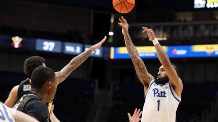 Nov 18, 2024; Pittsburgh, Pennsylvania, USA;  Pittsburgh Panthers guard Damian Dunn (1) shoots a three point basket against the Virginia Military Keydets during the second half at the Petersen Events Center. Mandatory Credit: Charles LeClaire-Imagn Images