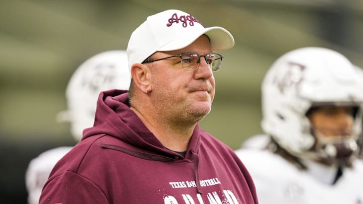Nov 8, 2025; Columbia, Missouri, USA; Texas A&M Aggies head coach Mike Elko watches warmups prior to a game against the Missouri Tigers at Faurot Field at Memorial Stadium. Mandatory Credit: Jay Biggerstaff-Imagn Images Nov 8, 2025; Columbia, Missouri, USA; Texas A&M Aggies head coach Mike Elko watches warmups prior to a game against the Missouri Tigers at Faurot Field at Memorial Stadium. Mandatory Credit: Jay Biggerstaff-Imagn Images