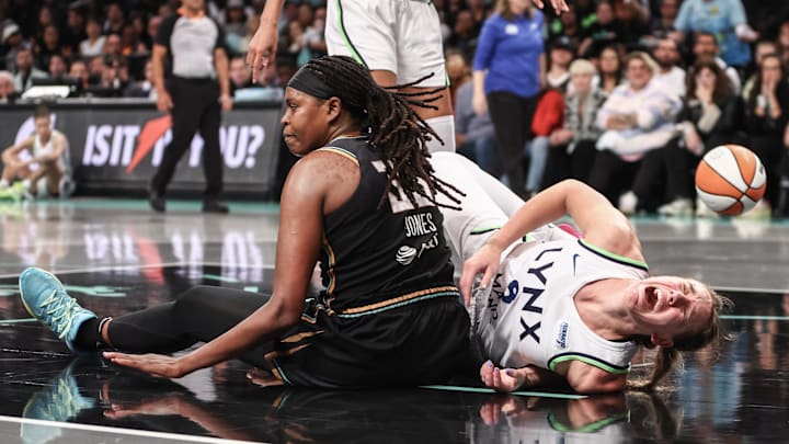 Oct 20, 2024; Brooklyn, New York, USA; Minnesota Lynx forward Alanna Smith (8) reacts after colliding with New York Liberty forward Jonquel Jones (35) during game five of the 2024 WNBA Finals at Barclays Center. Mandatory Credit: Wendell Cruz-Imagn Images Oct 20, 2024; Brooklyn, New York, USA; Minnesota Lynx forward Alanna Smith (8) reacts after colliding with New York Liberty forward Jonquel Jones (35) during game five of the 2024 WNBA Finals at Barclays Center. Mandatory Credit: Wendell Cruz-Imagn Images
