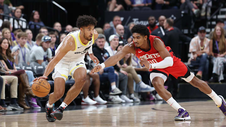 Oct 7, 2024; Salt Lake City, Utah, USA; Houston Rockets forward Jermaine Samuels Jr. (00) leaps for the ball dribbled by Utah Jazz guard Johnny Juzang (33) during the fourth quarter at Delta Center. Mandatory Credit: Rob Gray-Imagn Images