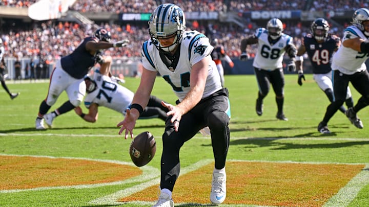 Oct 6, 2024; Chicago, Illinois, USA; Carolina Panthers quarterback Andy Dalton (14) collects a fumbles snap in the end zone against the Chicago Bears during the fourth quarter at Soldier Field. 